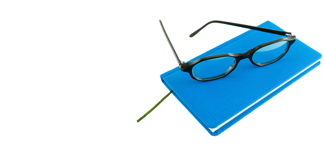 Glasses on a blue notebook